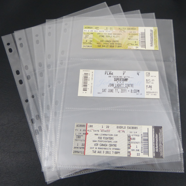 A stack of 5 binder pages, with tickets in the front page